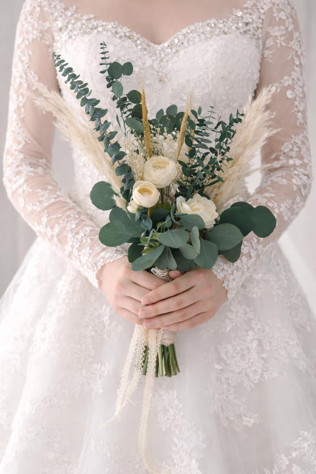 Bridal bouquet with preserved foliage and dried flowers is perfect for a minimalistic wedding theme. A beautiful mix of preserved eucalyptus, dried pampas grass, preserved gypsophila, dried wheat and artificial peonies.