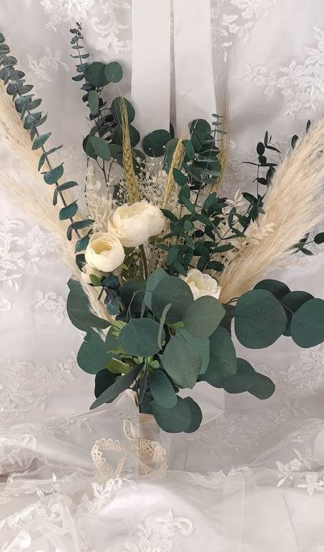 Bridal bouquet with preserved foliage and dried flowers is perfect for a minimalistic wedding theme. A beautiful mix of preserved eucalyptus, dried pampas grass, preserved gypsophila, dried wheat and artificial peonies.