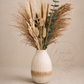 The bouquet includes oats, wild pampas grass, bunny tails, millet and eucalyptus. 