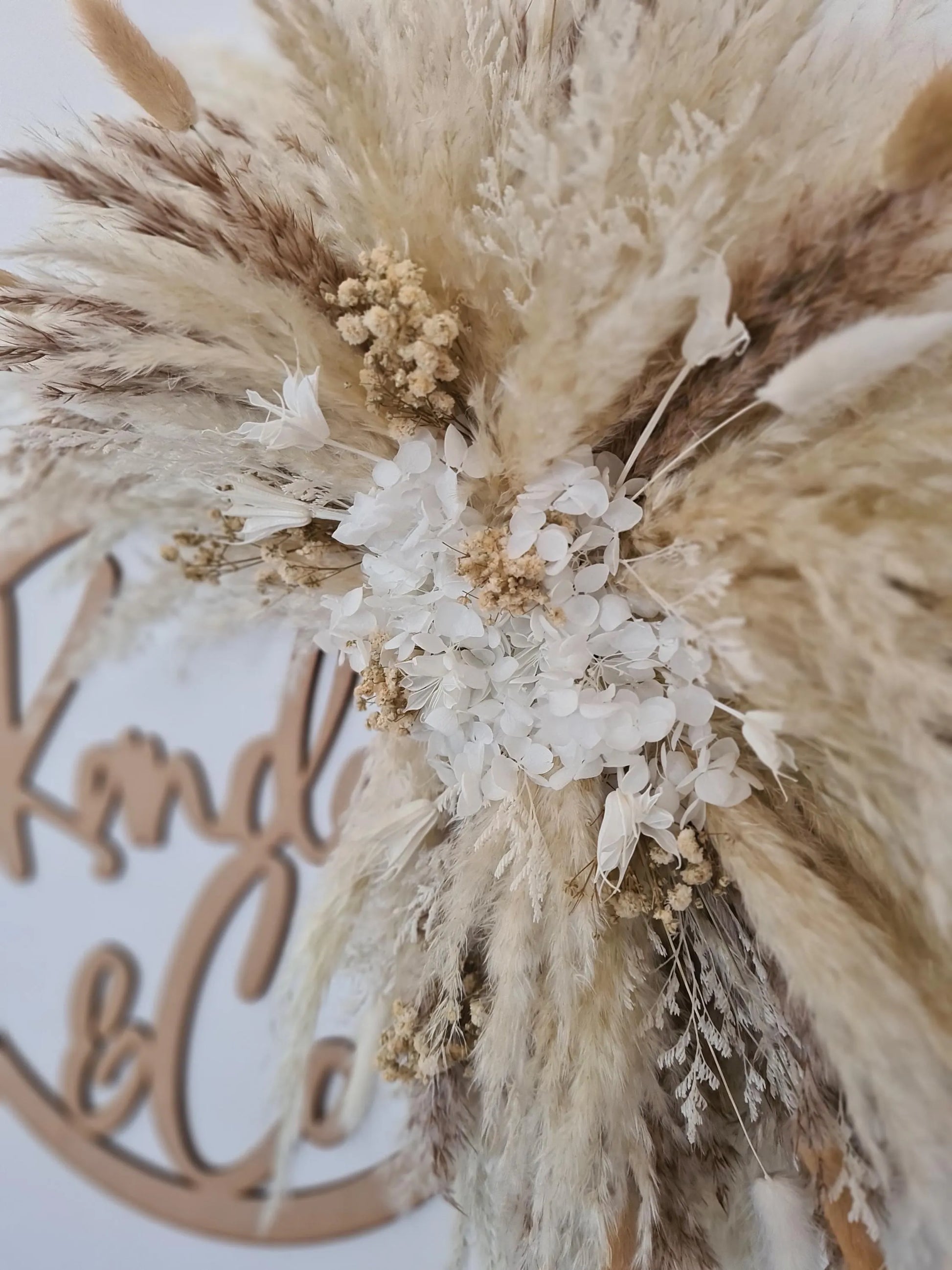 Decorative pampas arrangement handmade with pampas grass and flowers for signs and mirrors close up