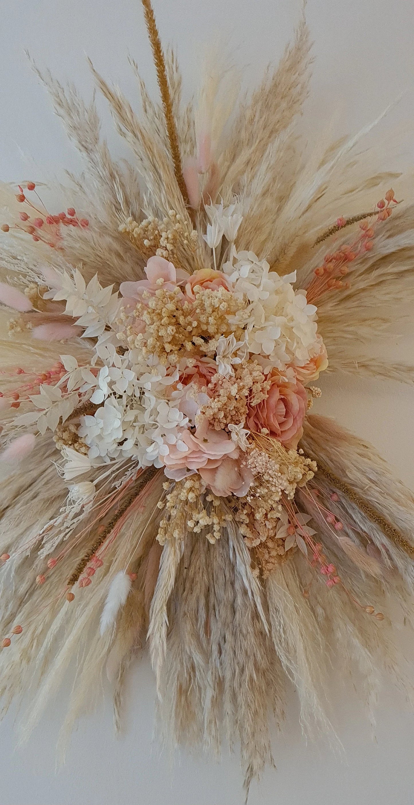 Handmade rustic pink pampas wall hanging floral arrangement with dried flowers and pampas grass