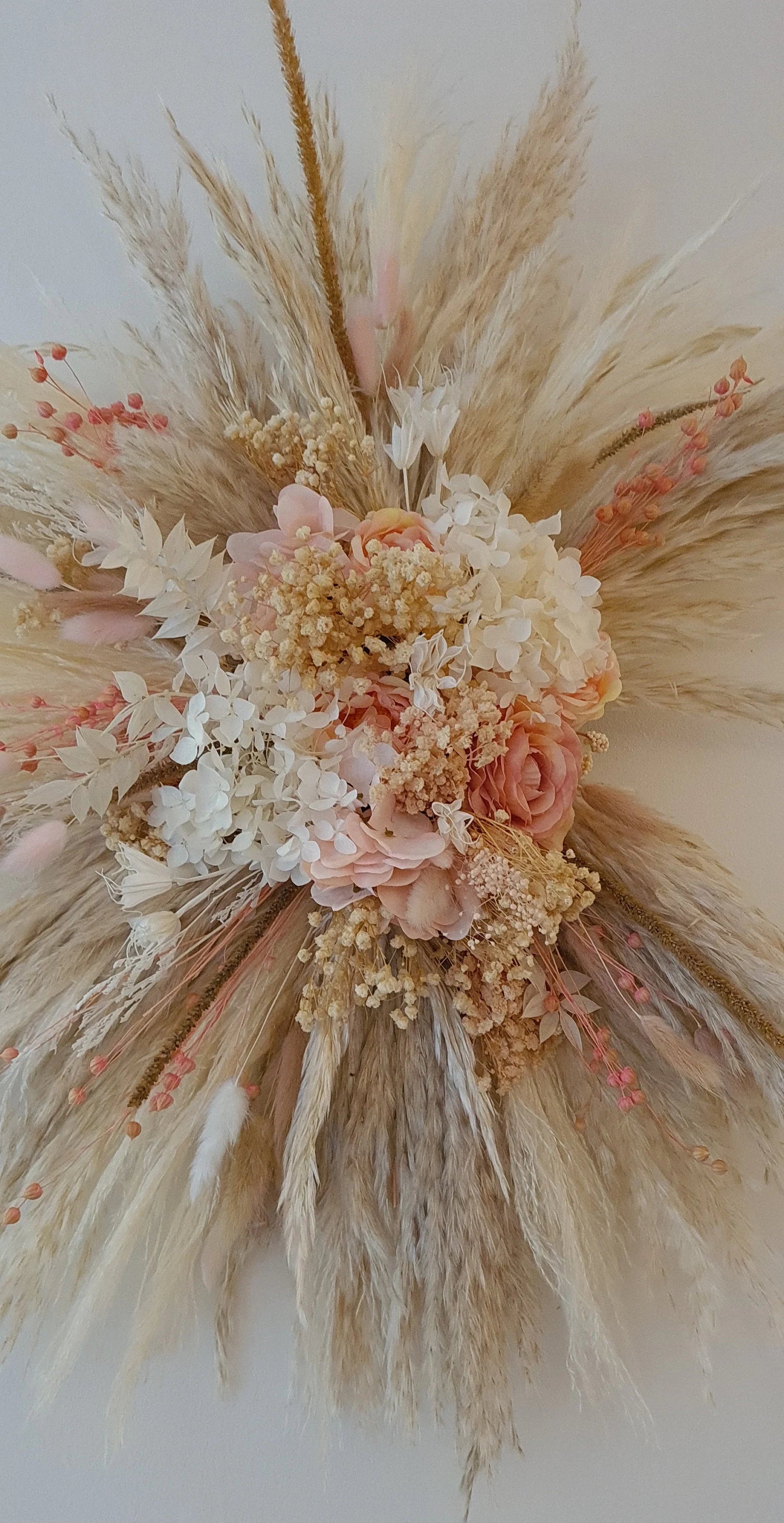 Handmade rustic pink pampas wall hanging floral arrangement with dried flowers and pampas grass