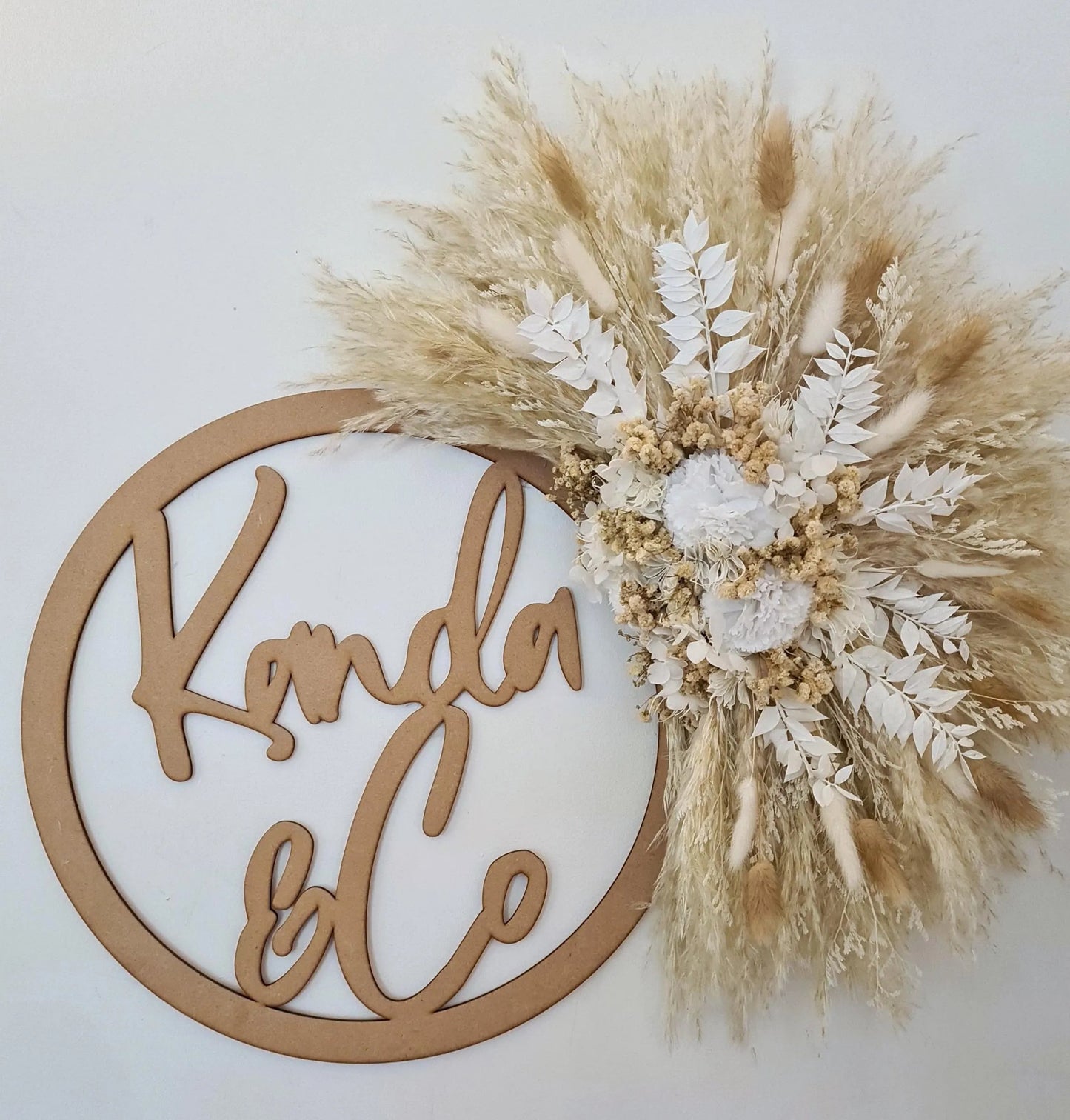 Handmade decorative wall piece made with dried flowers, pampas grass and bunnytails. 