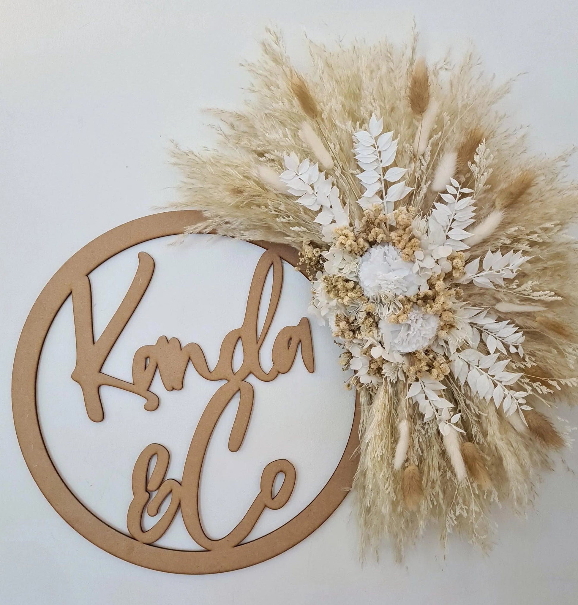 Handmade decorative wall piece made with dried flowers, pampas grass and bunnytails. 